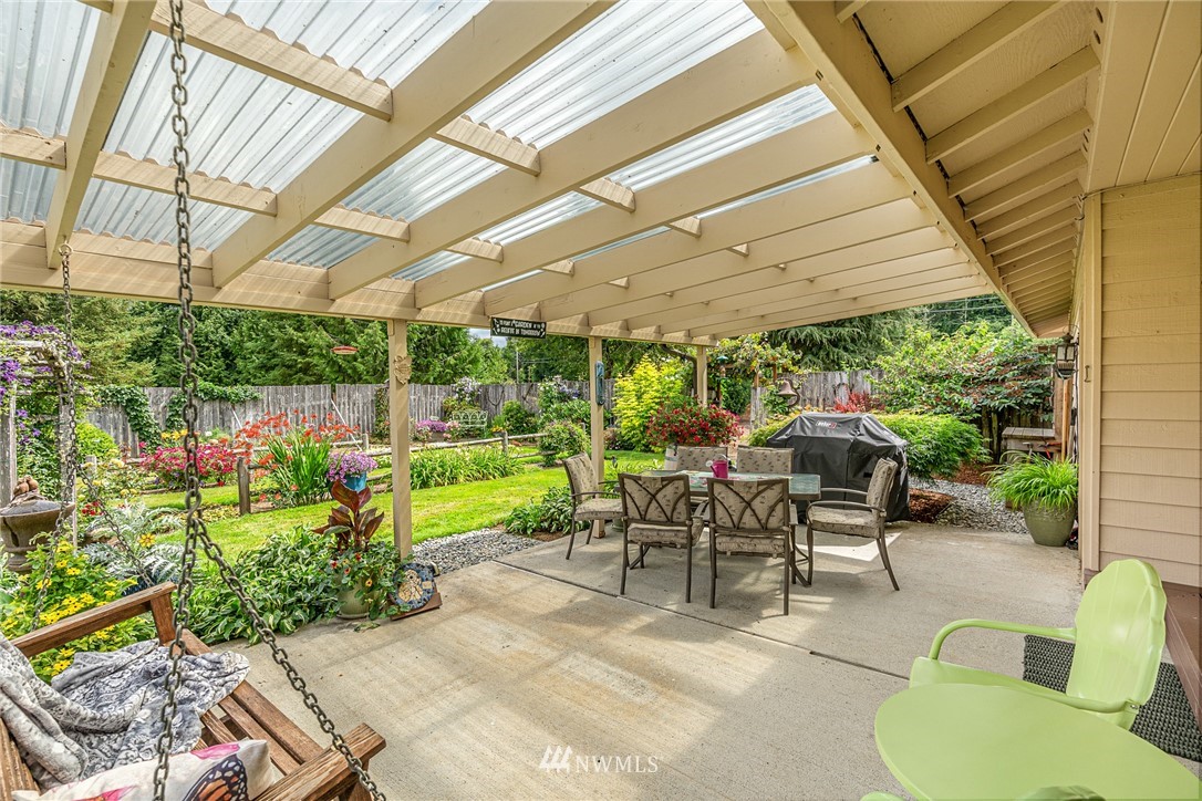 25431 Cromwell Road Monroe, WA 98272 - Photo 24 of 40 a view of a patio with a table and chairs under an umbrella