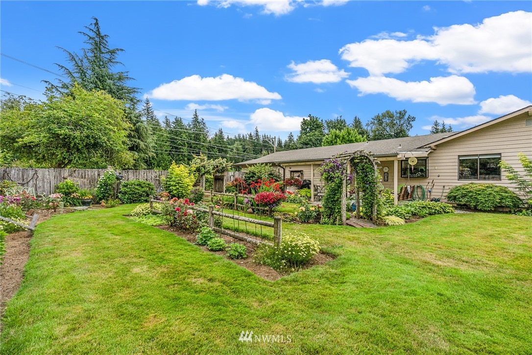 25431 Cromwell Road Monroe, WA 98272 - Photo 29 of 40 a view of a house with a big yard and potted plants