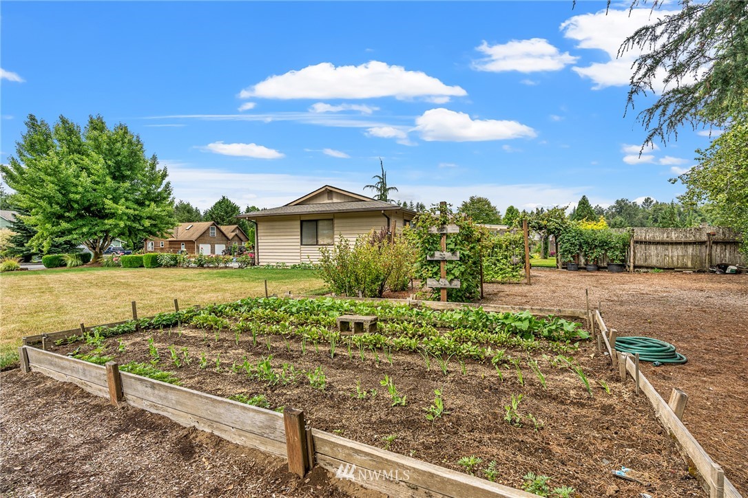 25431 Cromwell Road Monroe, WA 98272 - Photo 36 of 40 a view of a garden with an outdoor space
