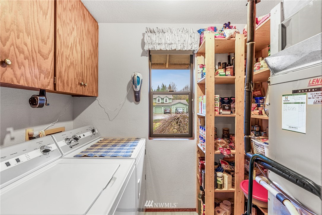 25431 Cromwell Road Monroe, WA 98272 - Photo 8 of 40 a utility room with refrigerator and washer