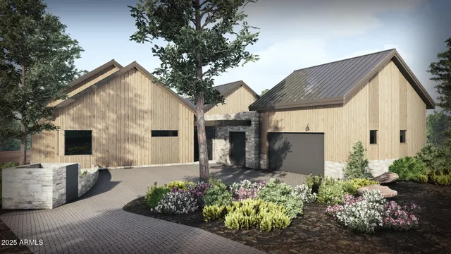 a front view of a house with a yard with potted plants
