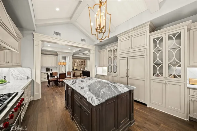 a kitchen that has a lot of cabinets in it