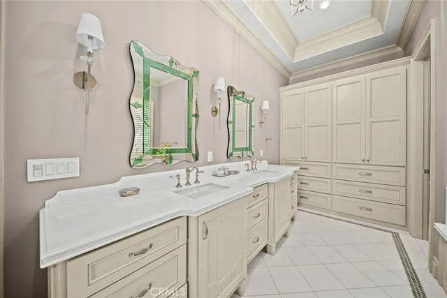 a bathroom with a double vanity sink mirror and