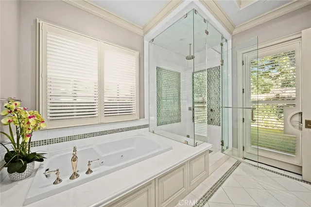 a spacious bathroom with a granite countertop tub and a sink