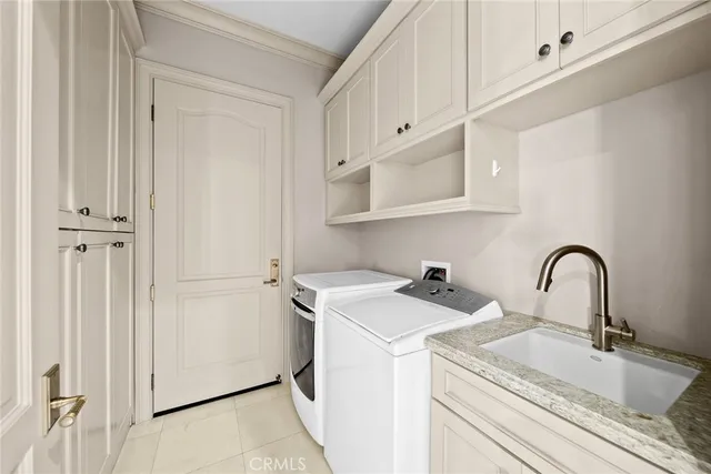 a view of a kitchen sink and cabinets