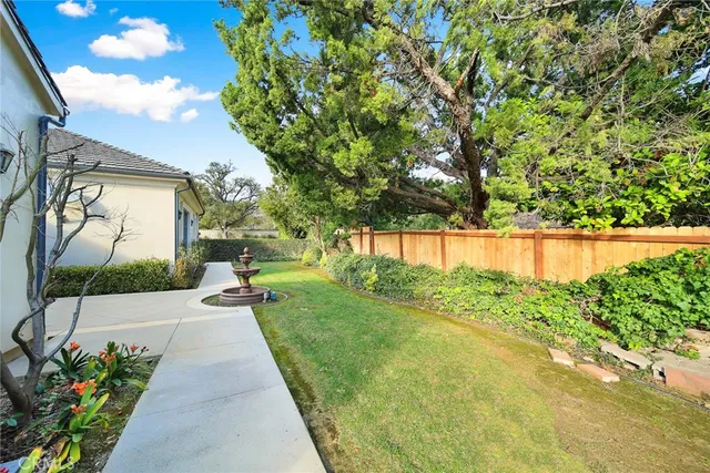 a view of a pathway with a garden
