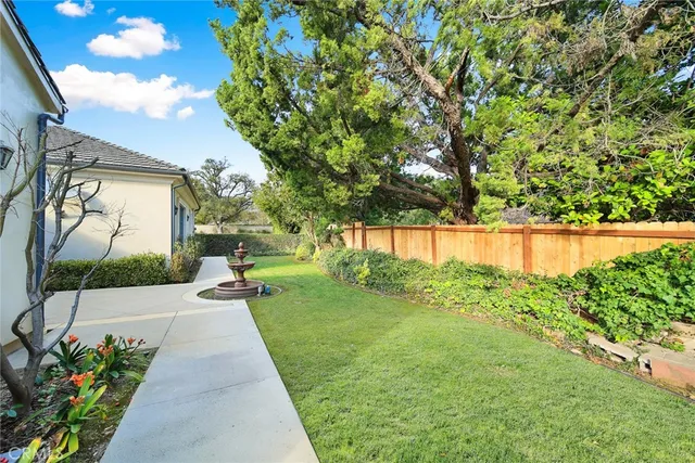a view of a pathway with a garden