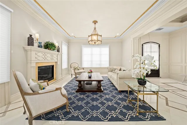 a living room with furniture a fireplace and a table