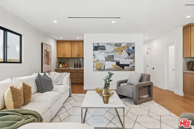 a living room with furniture and a painting