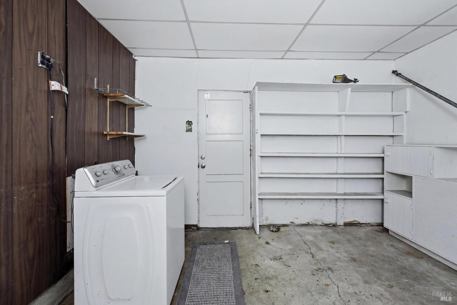 4941 Hansen Drive Santa Rosa, CA 95409 - Photo 34 of 35 Laundry room is just off the kitchen. Doubles as extra storage spot.