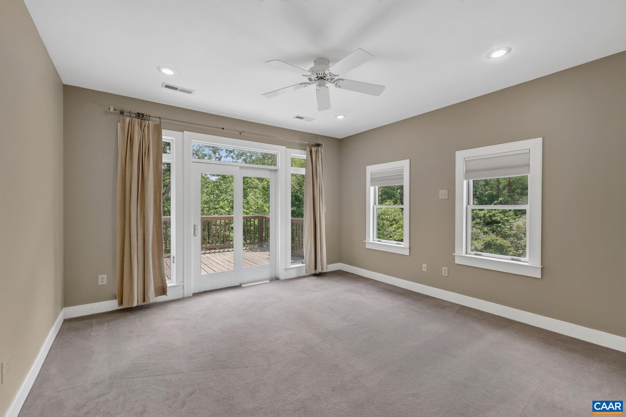 6285 Jarmans Gap Road Crozet, VA 22932 - Photo 17 of 65 an empty room with a ceiling fan and windows