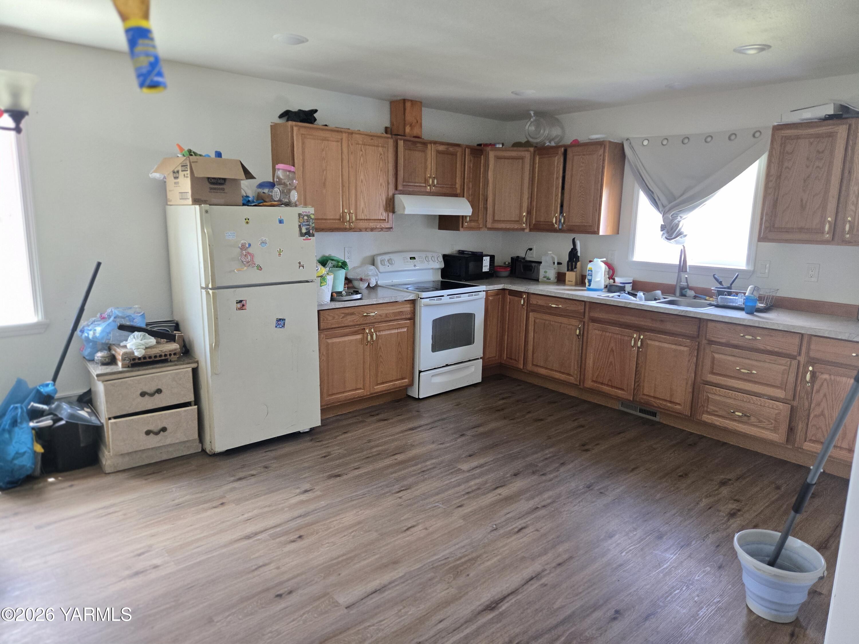 208 North Chestnut Street Toppenish, WA 98948 - Photo 5 of 10 a kitchen with sink a stove and cabinets
