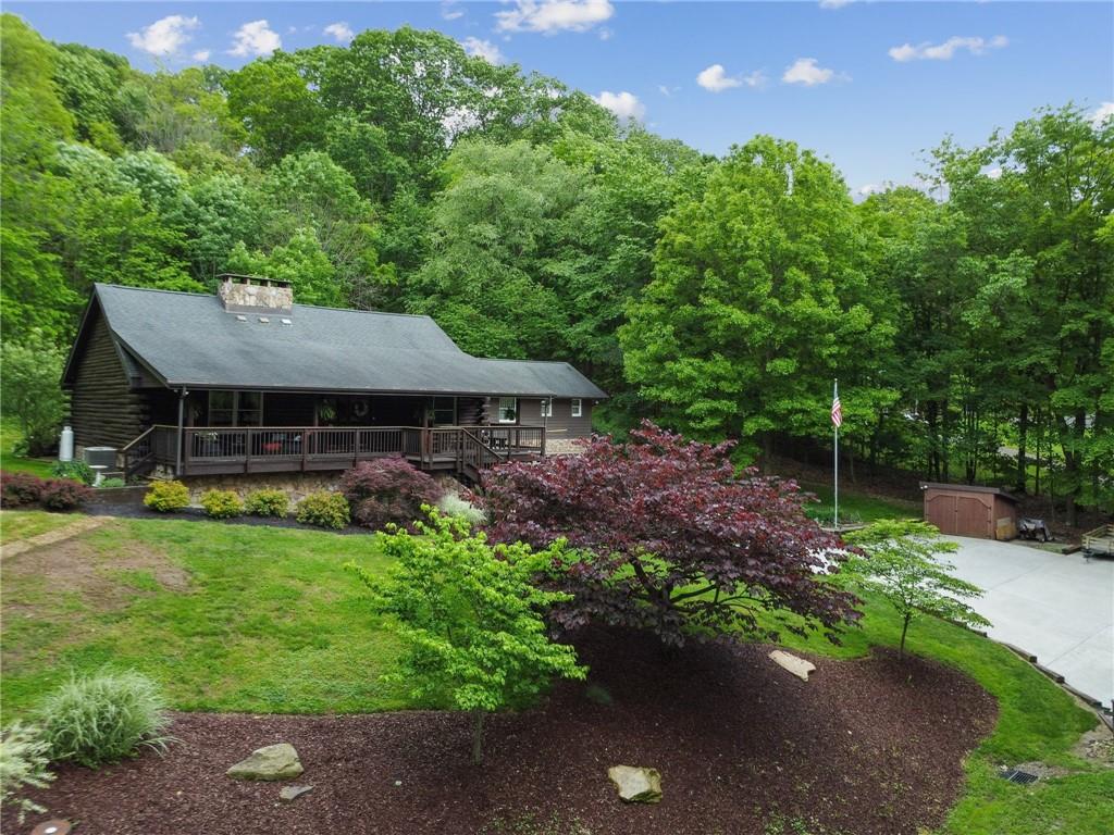 147 David Shotts Road Ruffs Dale, PA 15679 - Photo 26 of 28 a view of a house with a garden