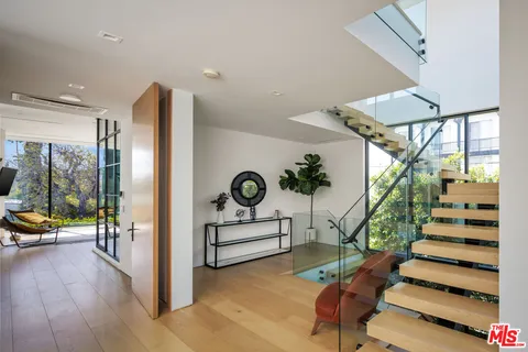 a bedroom with a bed and a fireplace