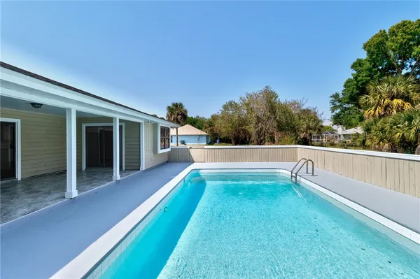 a house view with a sitting space and garden space