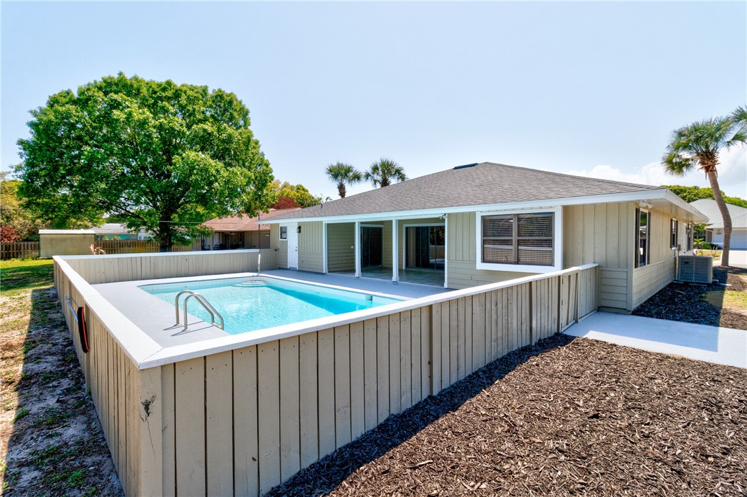 462 Watercrest Street Sebastian, FL 32958 - Photo 33 of 36 a view of a house with a backyard