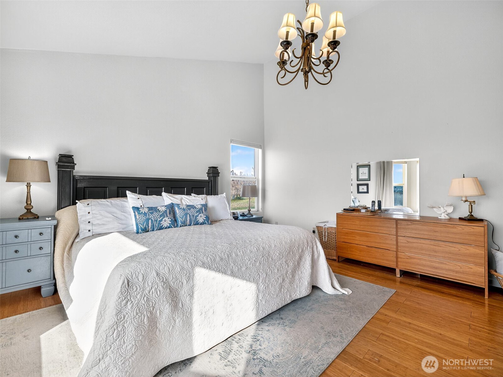 430 Gail Road Ellensburg, WA 98926 - Photo 28 of 40 a bed room with a bed and a chandelier