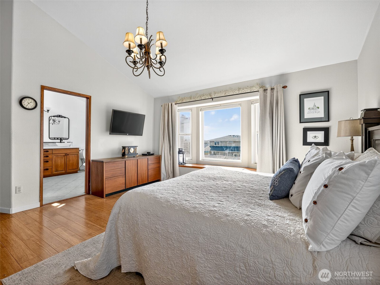 430 Gail Road Ellensburg, WA 98926 - Photo 29 of 40 a bedroom with a bed and a chandelier