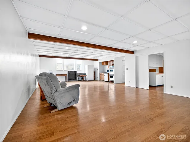 a lobby with furniture and floor to ceiling window