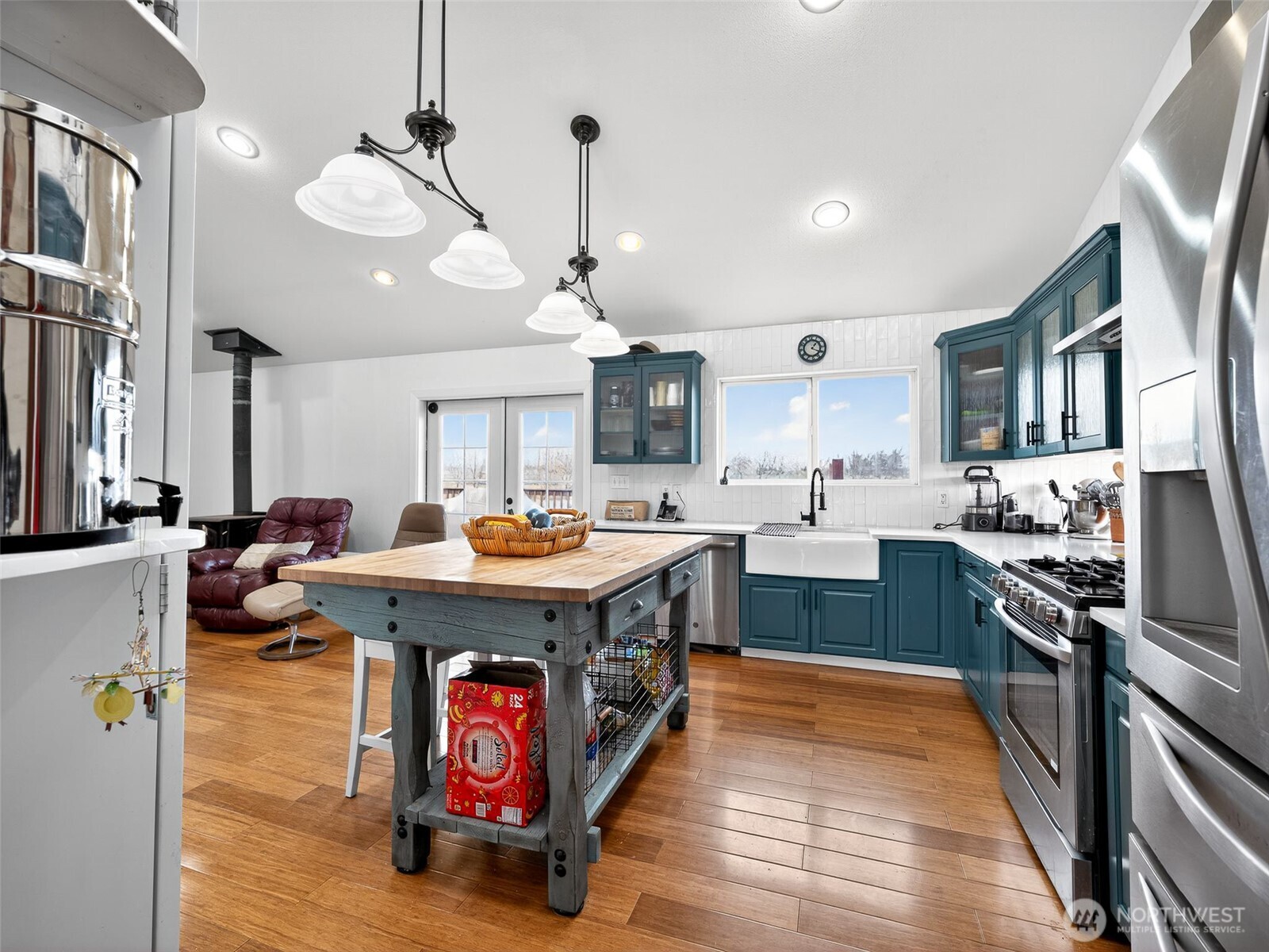 430 Gail Road Ellensburg, WA 98926 - Photo 8 of 40 a kitchen with kitchen island a sink stove a refrigerator and chairs