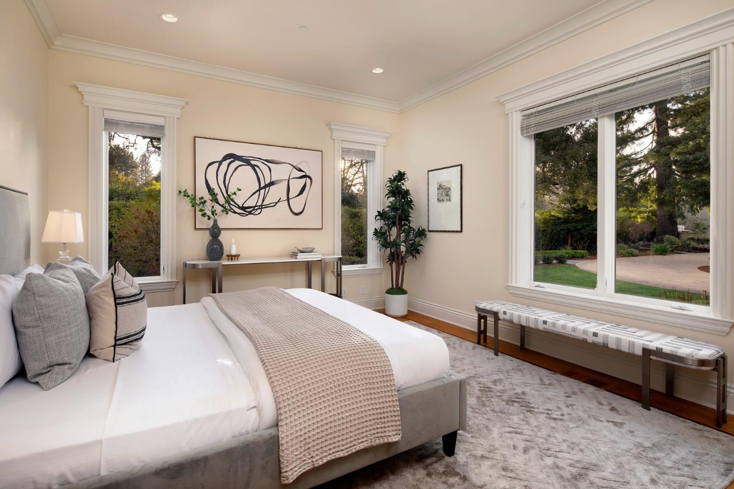 89 Almendral Avenue Atherton, CA 94027 - Photo 17 of 26 a spacious bedroom with a large bed and a large window