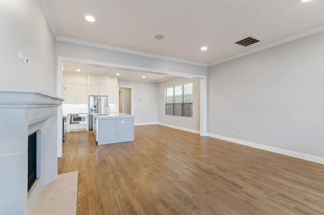 a view of a living room kitchen with a fireplace
