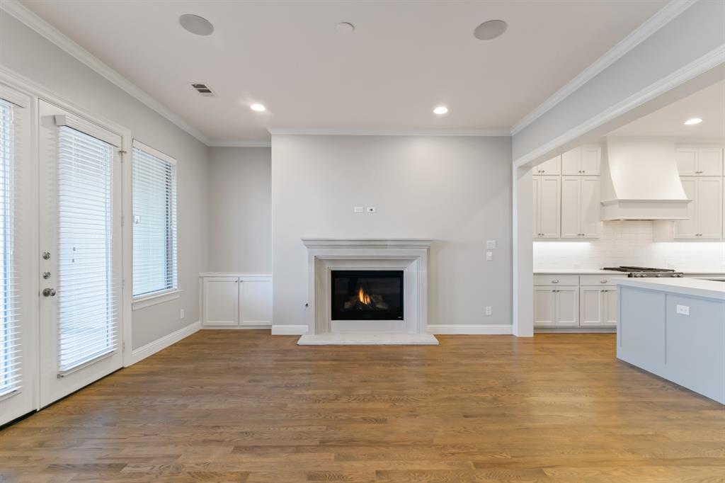 6531 Roper Street Dallas, TX 75209 - Photo 16 of 40 a living room with stainless steel appliances granite countertop a fireplace and a window