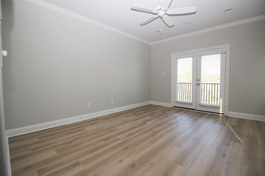 6531 Roper Street Dallas, TX 75209 - Photo 22 of 40 wooden floor in an empty room with a window