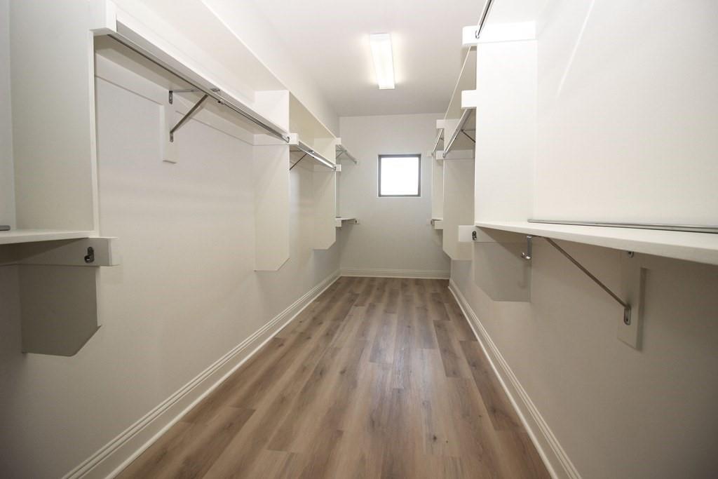 6531 Roper Street Dallas, TX 75209 - Photo 26 of 40 a view of a room with wooden floor and white walls