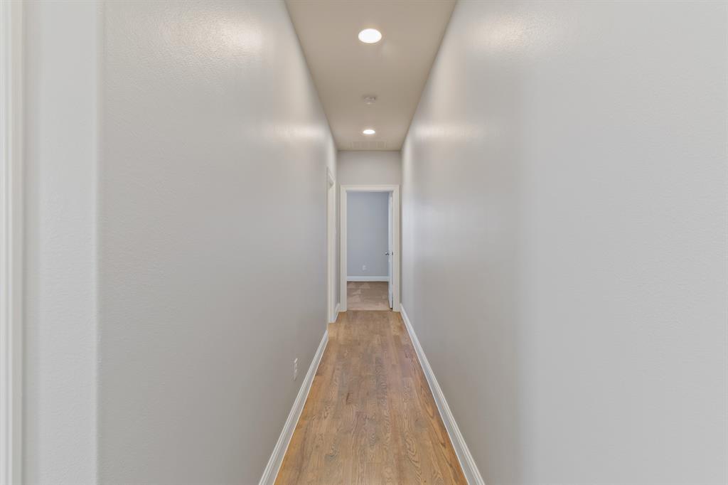 6531 Roper Street Dallas, TX 75209 - Photo 28 of 40 a view of a hallway with wooden floor