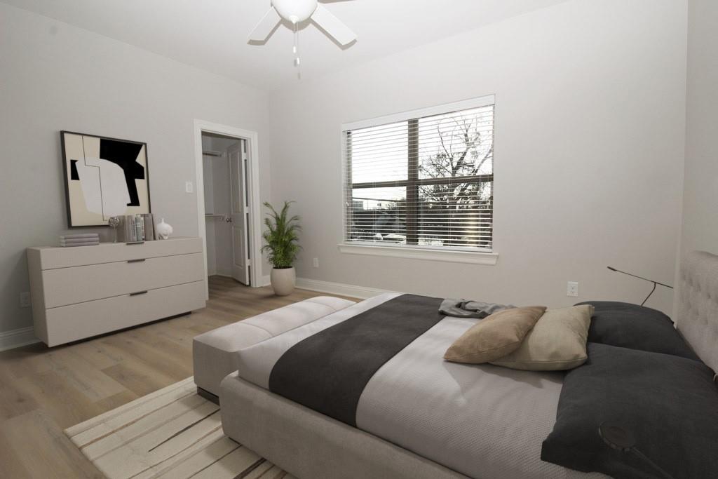 6531 Roper Street Dallas, TX 75209 - Photo 29 of 40 a bedroom with a large bed and a window