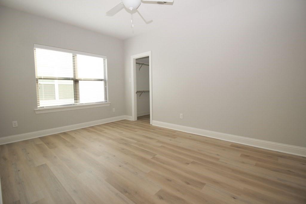 6531 Roper Street Dallas, TX 75209 - Photo 32 of 40 an empty room with wooden floor and windows