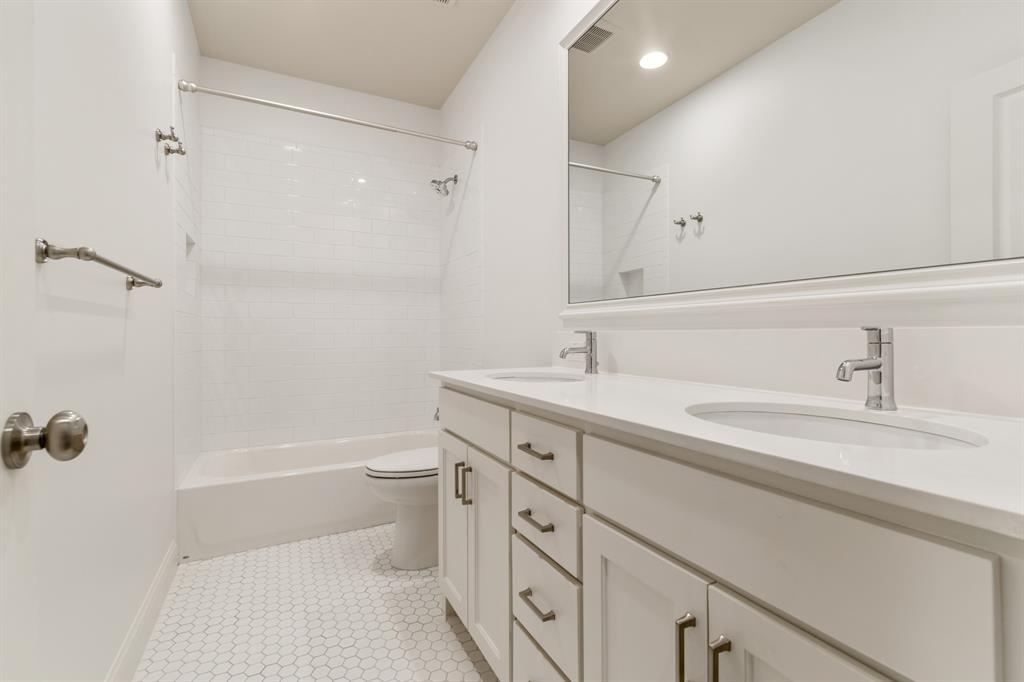6531 Roper Street Dallas, TX 75209 - Photo 33 of 40 a bathroom with a sink a toilet and shower
