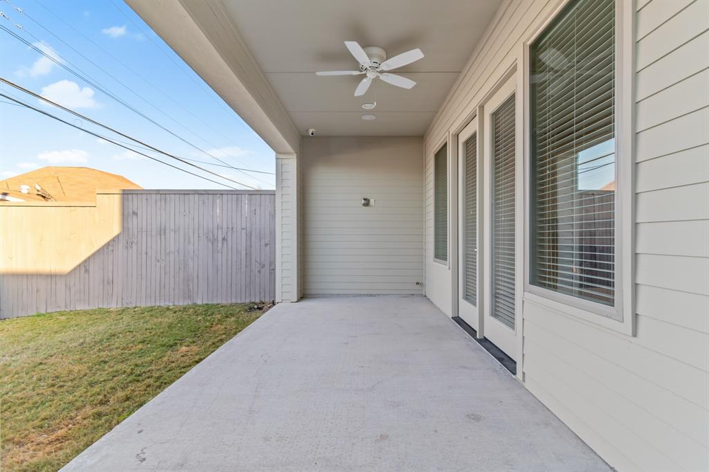 6531 Roper Street Dallas, TX 75209 - Photo 37 of 40 a view of a backyard with a large tree