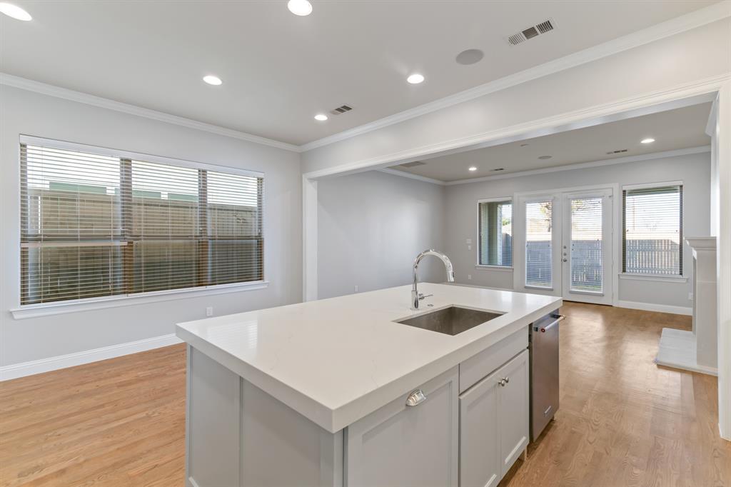 6531 Roper Street Dallas, TX 75209 - Photo 9 of 40 a kitchen with a sink and large window