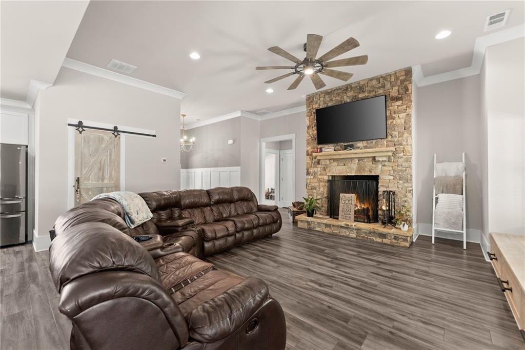 970 GA Highway 211 Winder, GA 30680 - Photo 13 of 60 a living room with furniture fireplace and a flat screen tv
