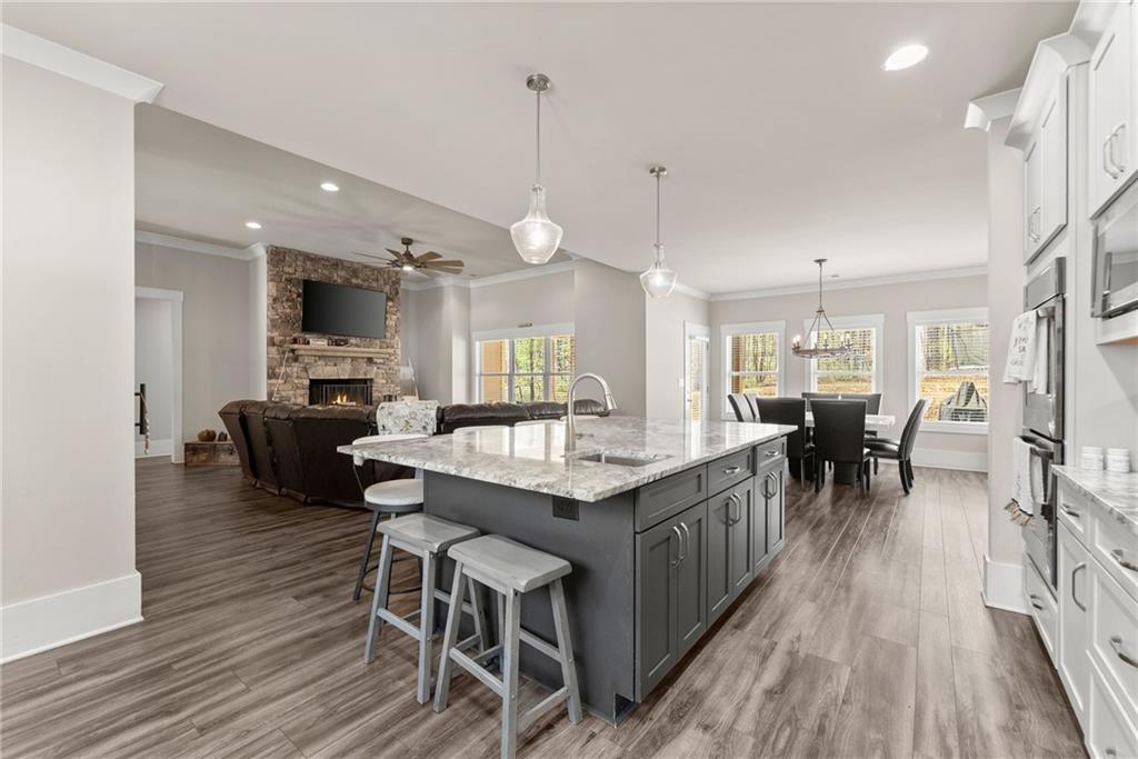 970 GA Highway 211 Winder, GA 30680 - Photo 16 of 60 a kitchen with stainless steel appliances granite countertop a kitchen island a stove a table and chairs