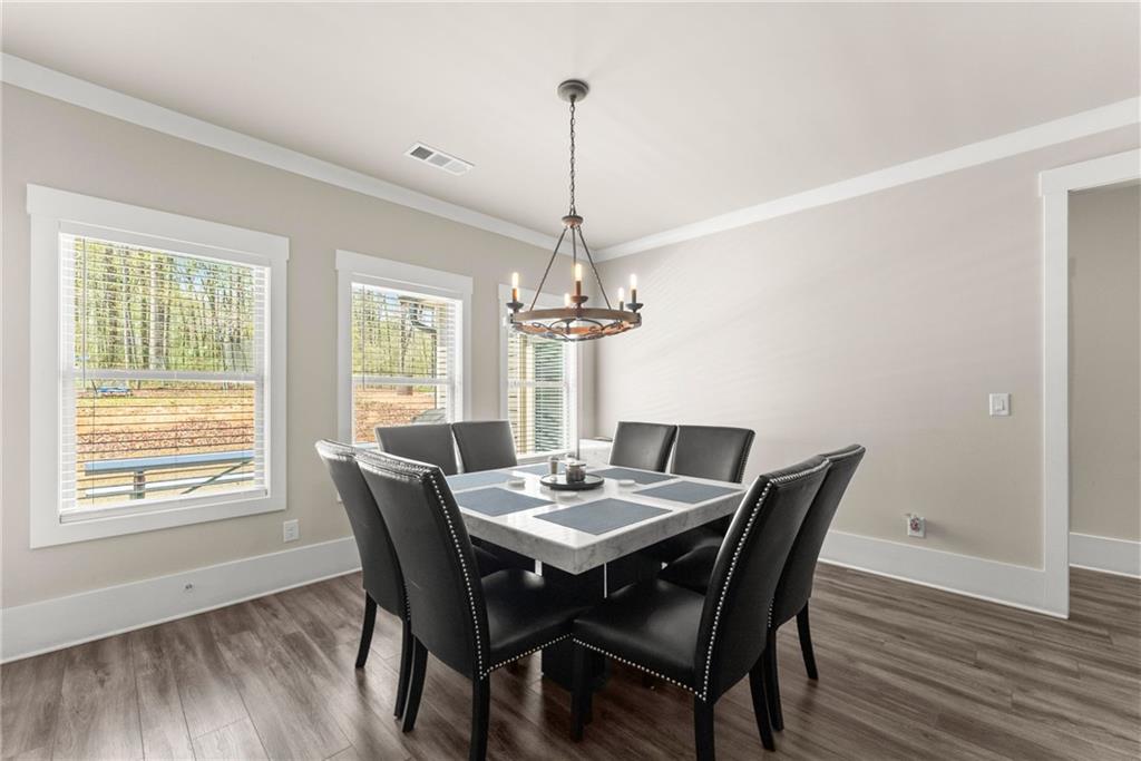 970 GA Highway 211 Winder, GA 30680 - Photo 18 of 60 a dining room with furniture window wooden floor