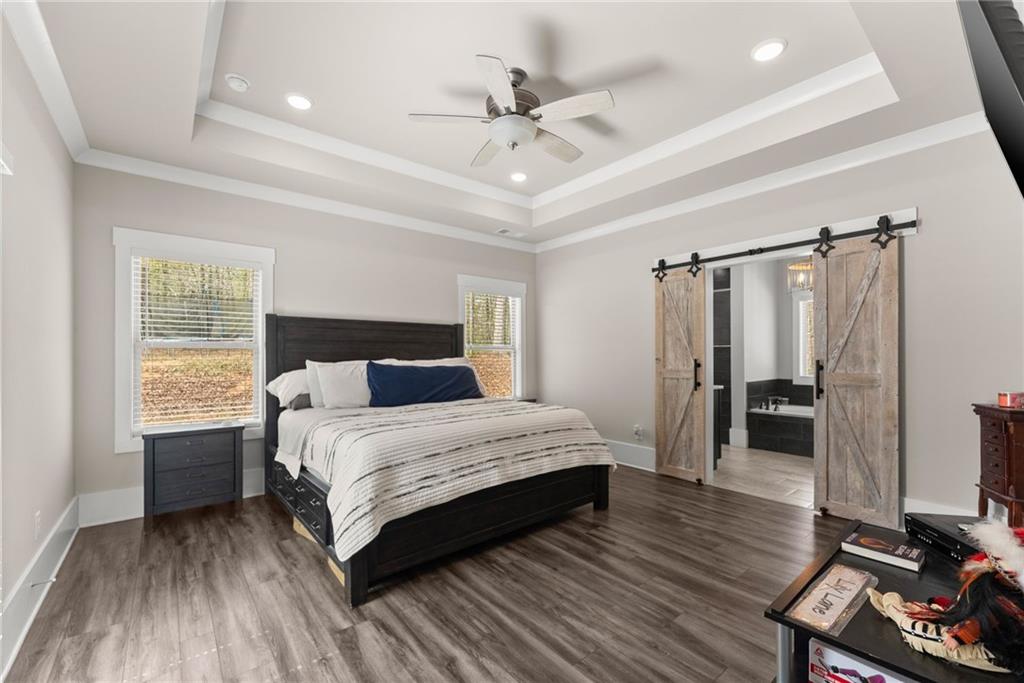 970 GA Highway 211 Winder, GA 30680 - Photo 21 of 60 a bedroom with a bed and a table