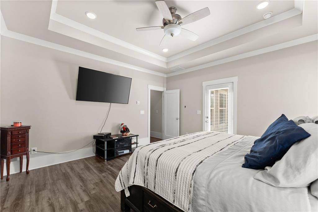 970 GA Highway 211 Winder, GA 30680 - Photo 22 of 60 a bedroom with a bed and a flat screen tv