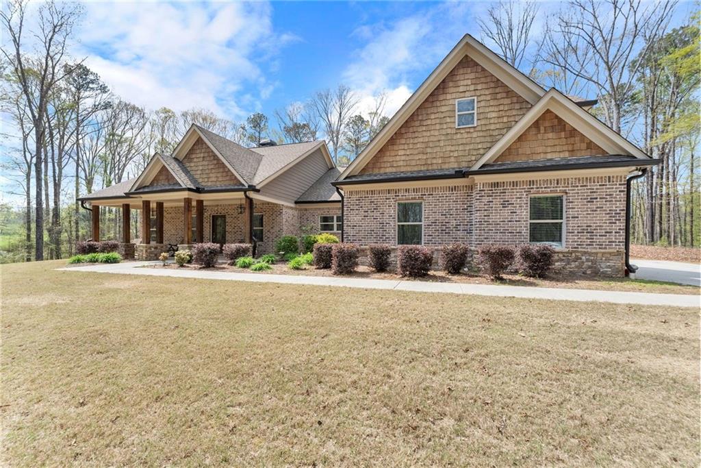 970 GA Highway 211 Winder, GA 30680 - Photo 3 of 60 a front view of a house with a yard