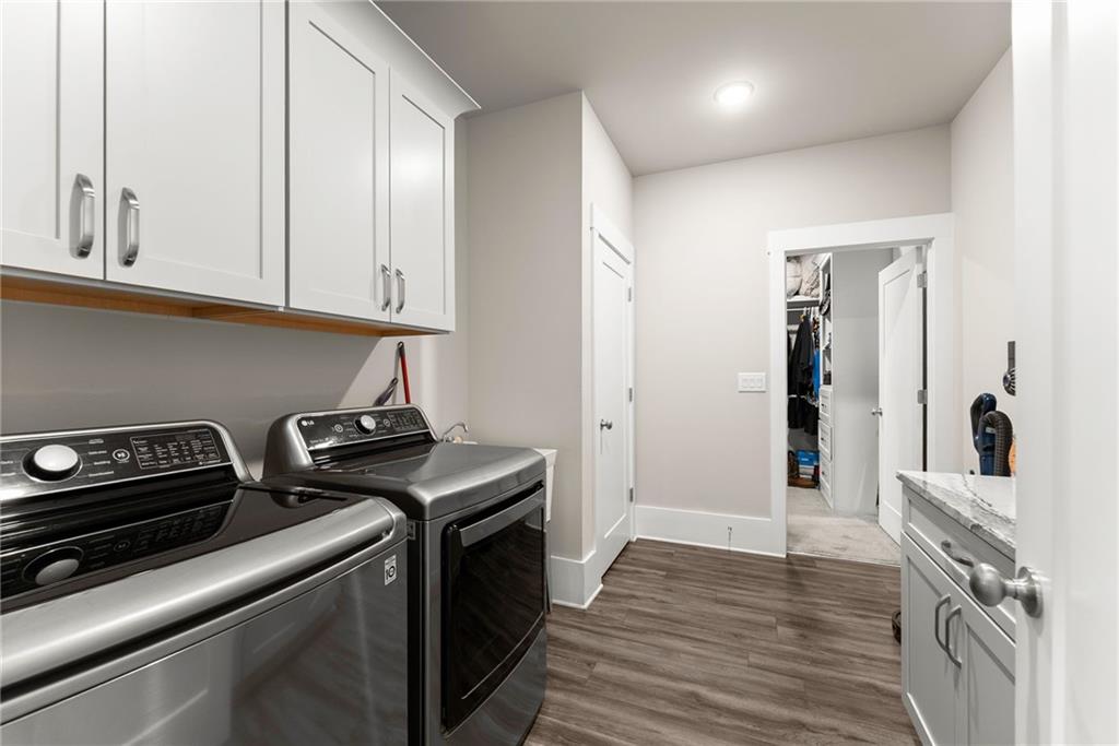 970 GA Highway 211 Winder, GA 30680 - Photo 31 of 60 a kitchen with a stove and a wooden floor