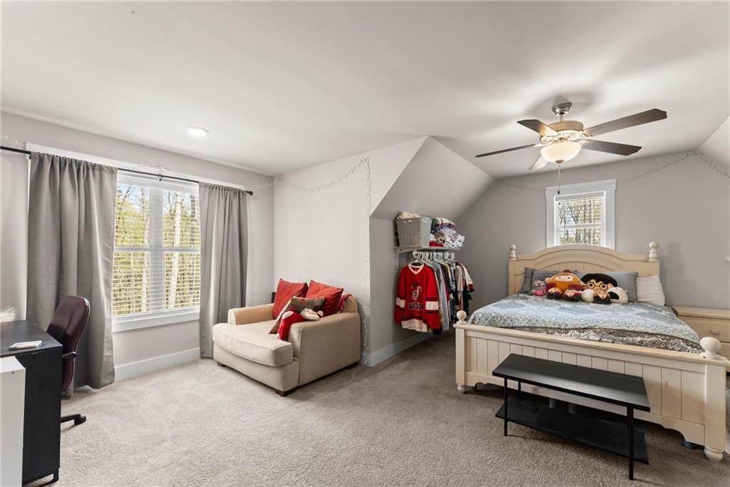 970 GA Highway 211 Winder, GA 30680 - Photo 36 of 60 a bedroom with furniture and a bed