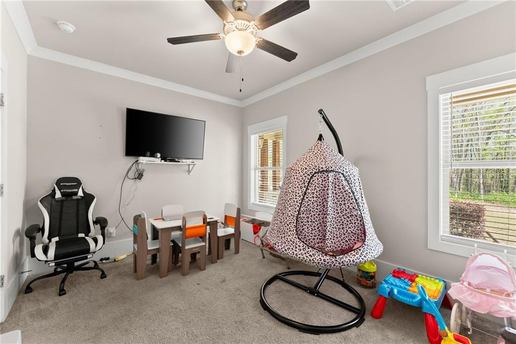 970 GA Highway 211 Winder, GA 30680 - Photo 38 of 60 a living room with furniture a window and a flat screen tv