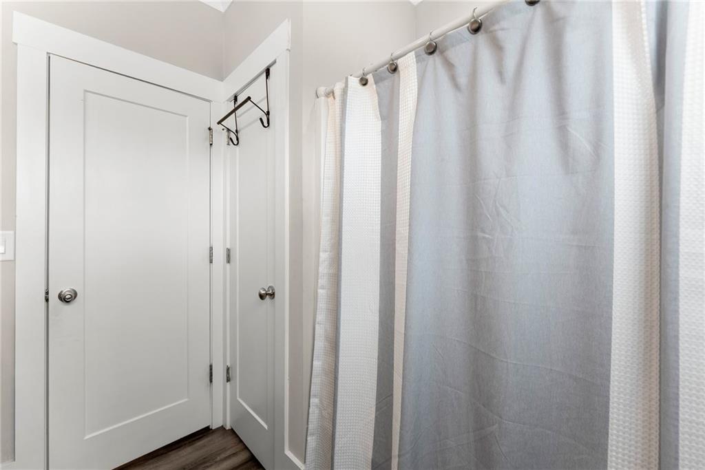 970 GA Highway 211 Winder, GA 30680 - Photo 40 of 60 a view of a bathroom with a shower and a wooden floor