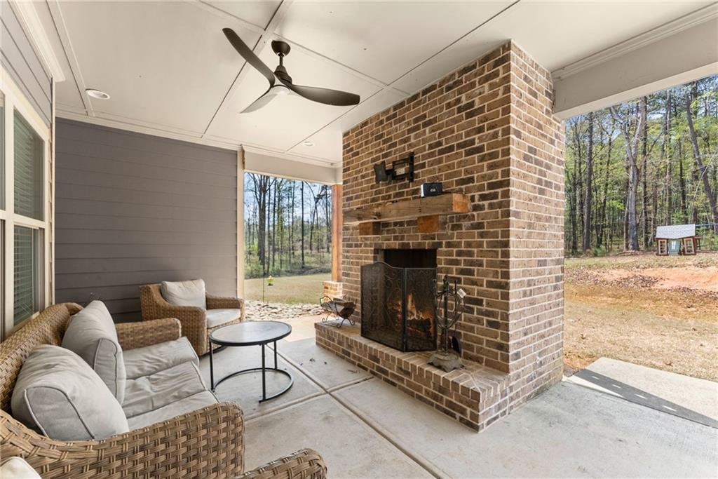 970 GA Highway 211 Winder, GA 30680 - Photo 43 of 60 a living room with furniture and a fireplace