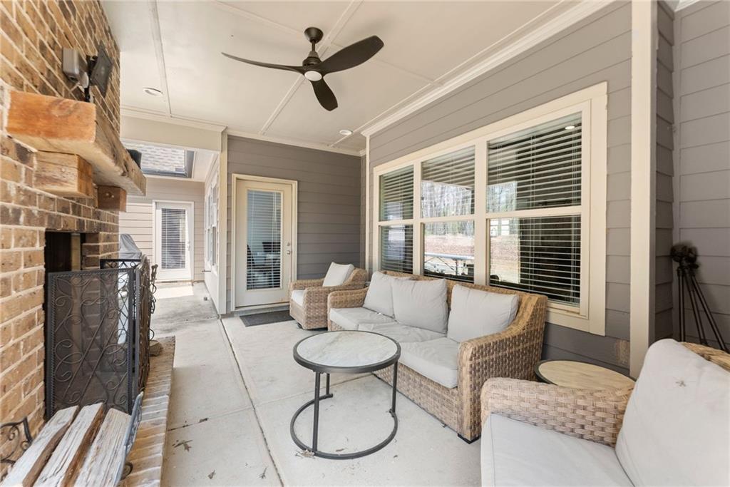 970 GA Highway 211 Winder, GA 30680 - Photo 44 of 60 a living room with furniture a window and a chandelier