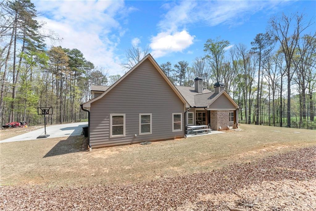 970 GA Highway 211 Winder, GA 30680 - Photo 49 of 60 a view of a house with a yard covered in snow