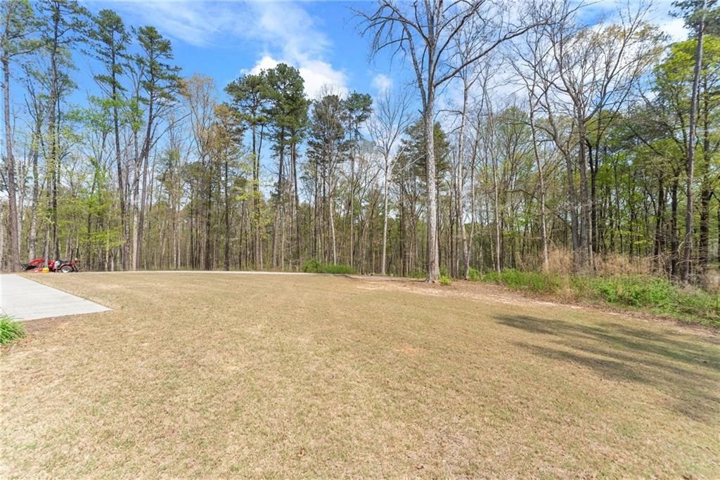 970 GA Highway 211 Winder, GA 30680 - Photo 52 of 60 a house with trees in front of it