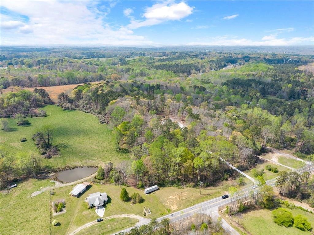 970 GA Highway 211 Winder, GA 30680 - Photo 56 of 60 a view of a lake with green field
